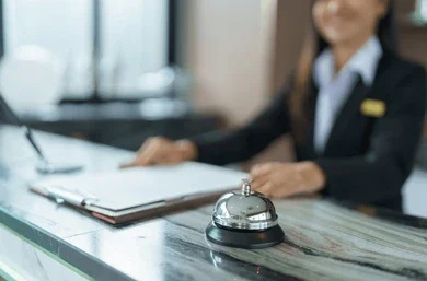 hotel receptionist uniforms desk lobby 260nw 2487074851 e1769260536724